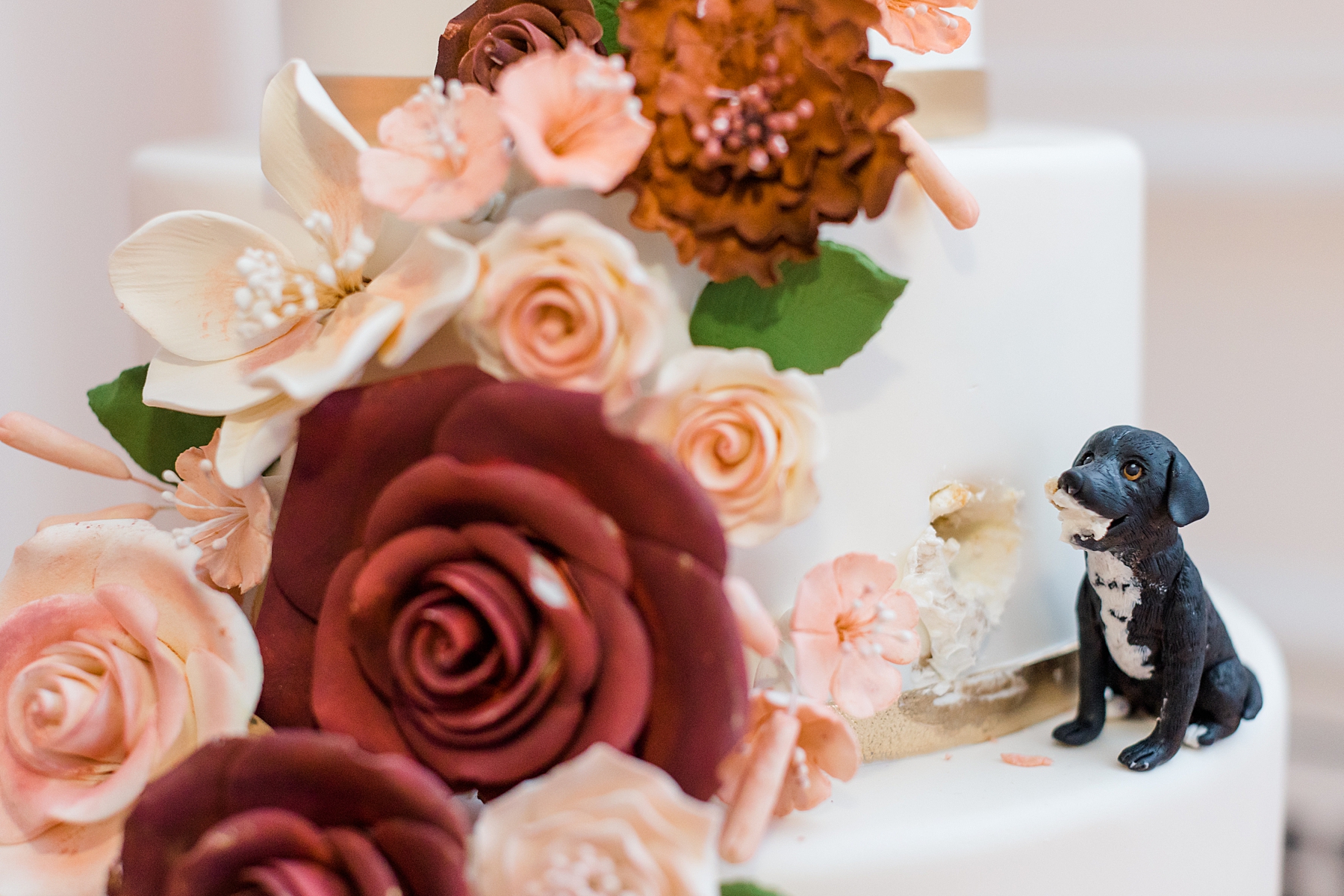 dog figurine on wedding cake from The Down Town Club Wedding