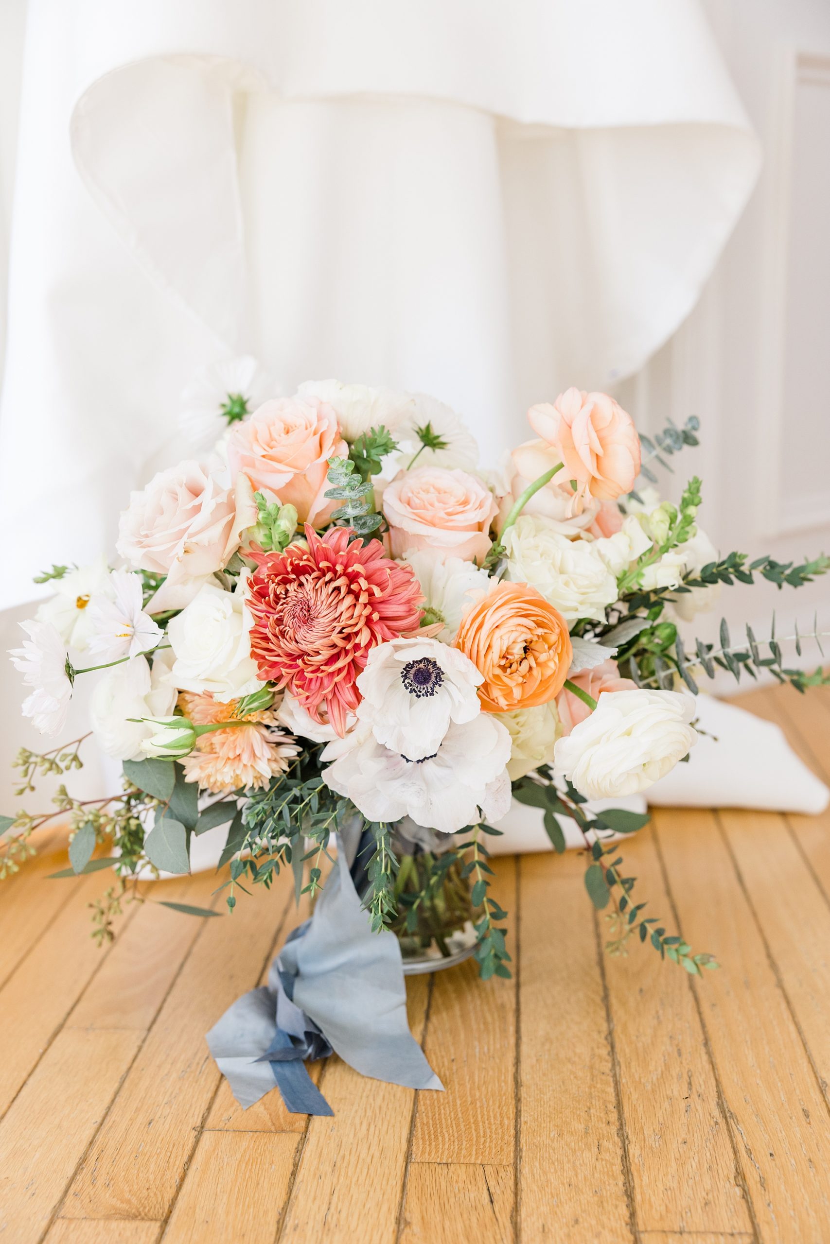 romantic wedding bouquet of white, peach, and blush