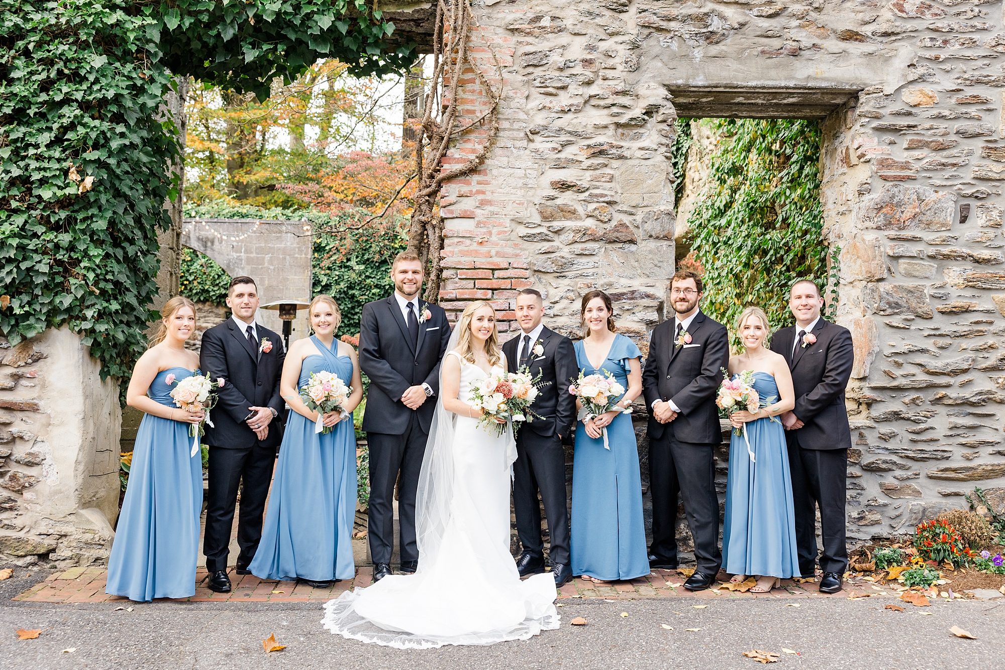 wedding party at the old stone ruins at The Old Mill in Rose Valley