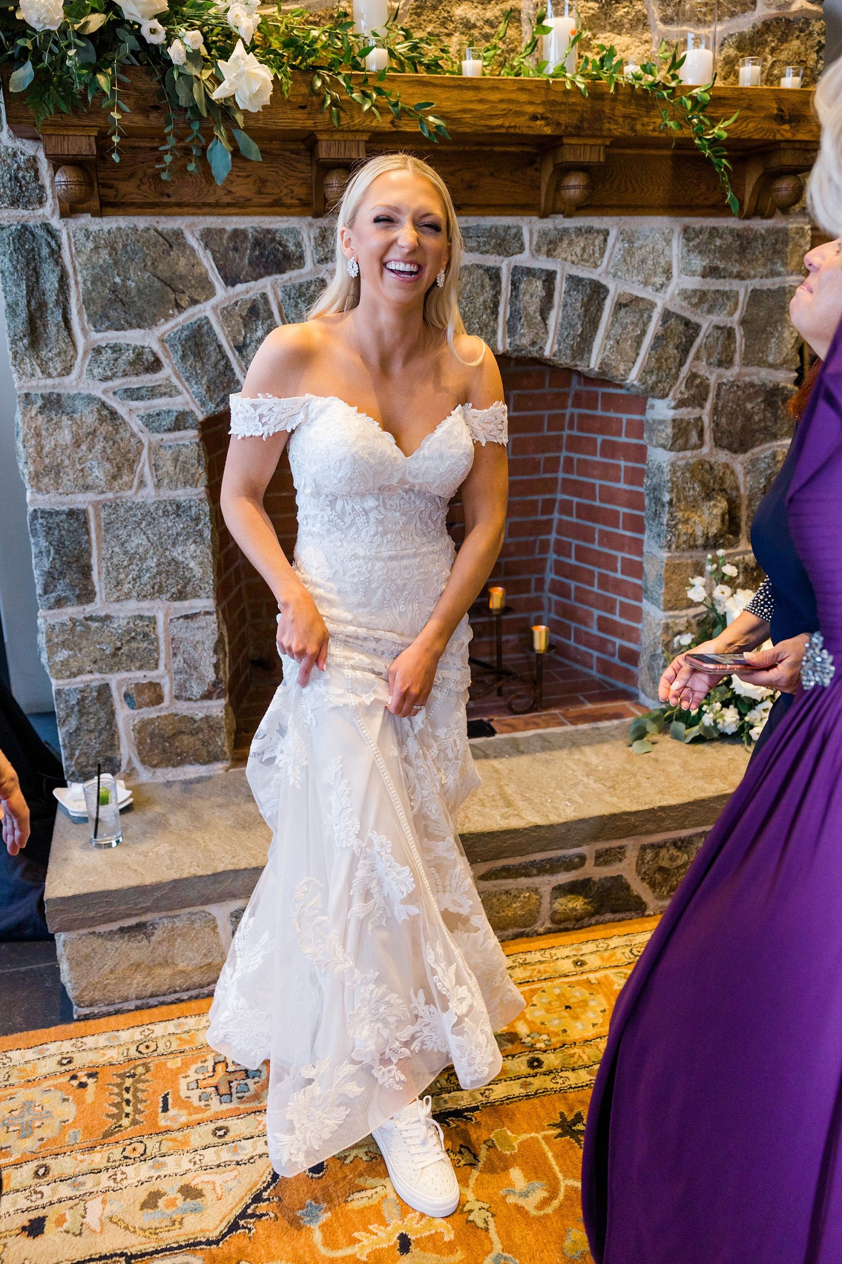 bride showing off comfy white shoes 