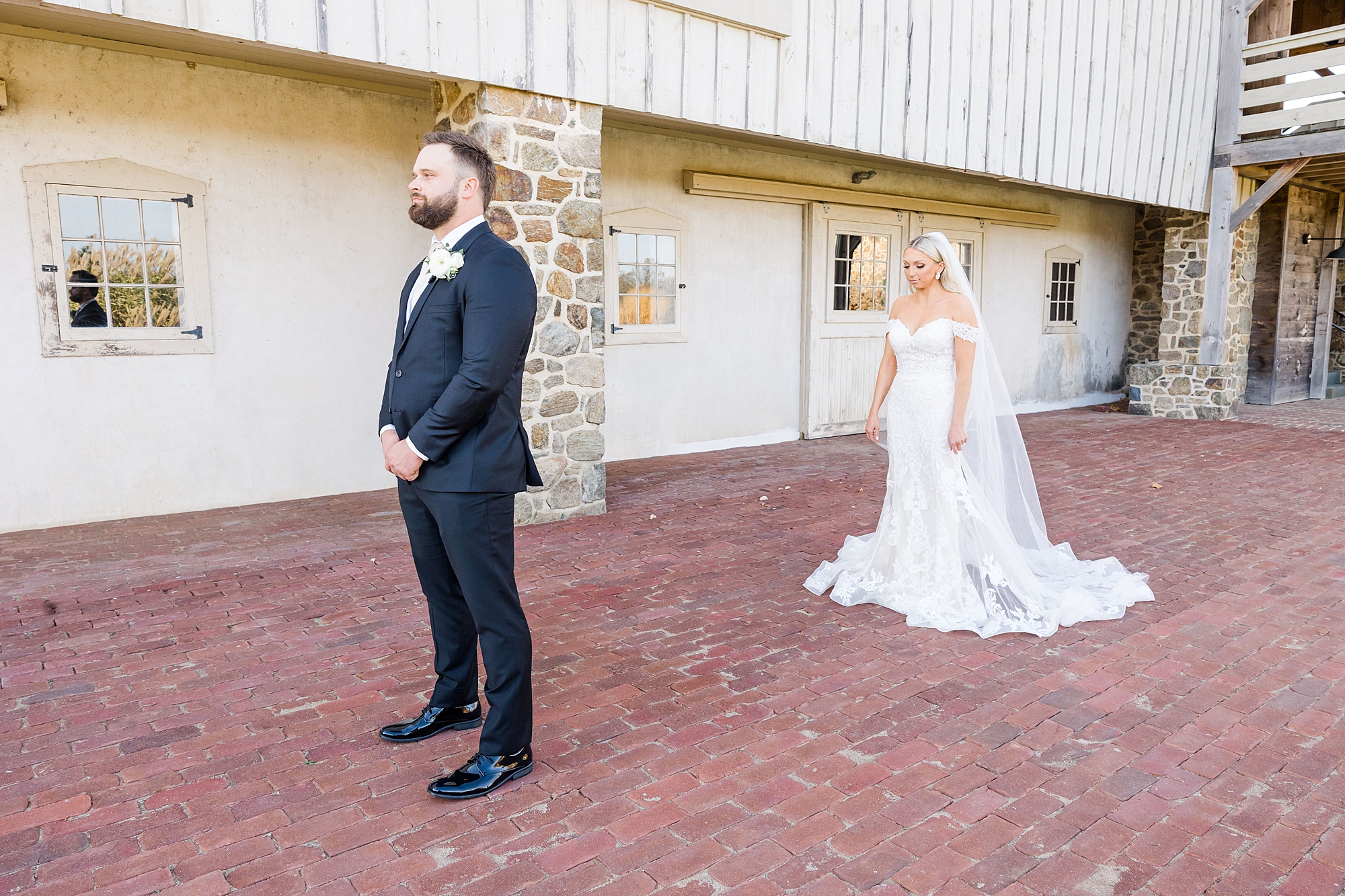 bride behind groom moments before first look