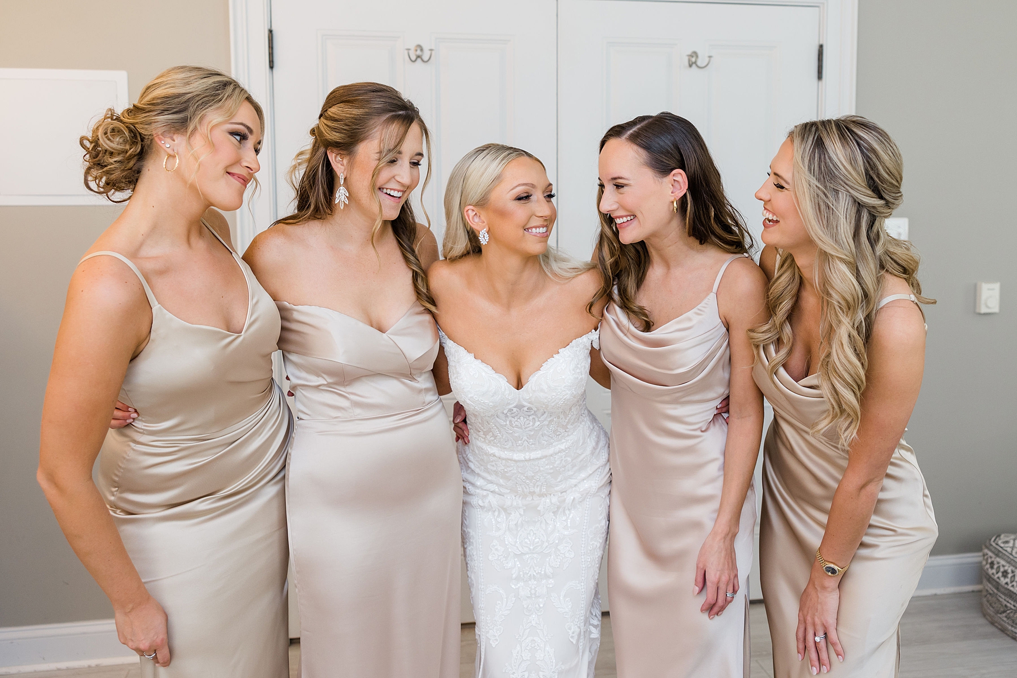 bride and bridesmaids in champagne dresses