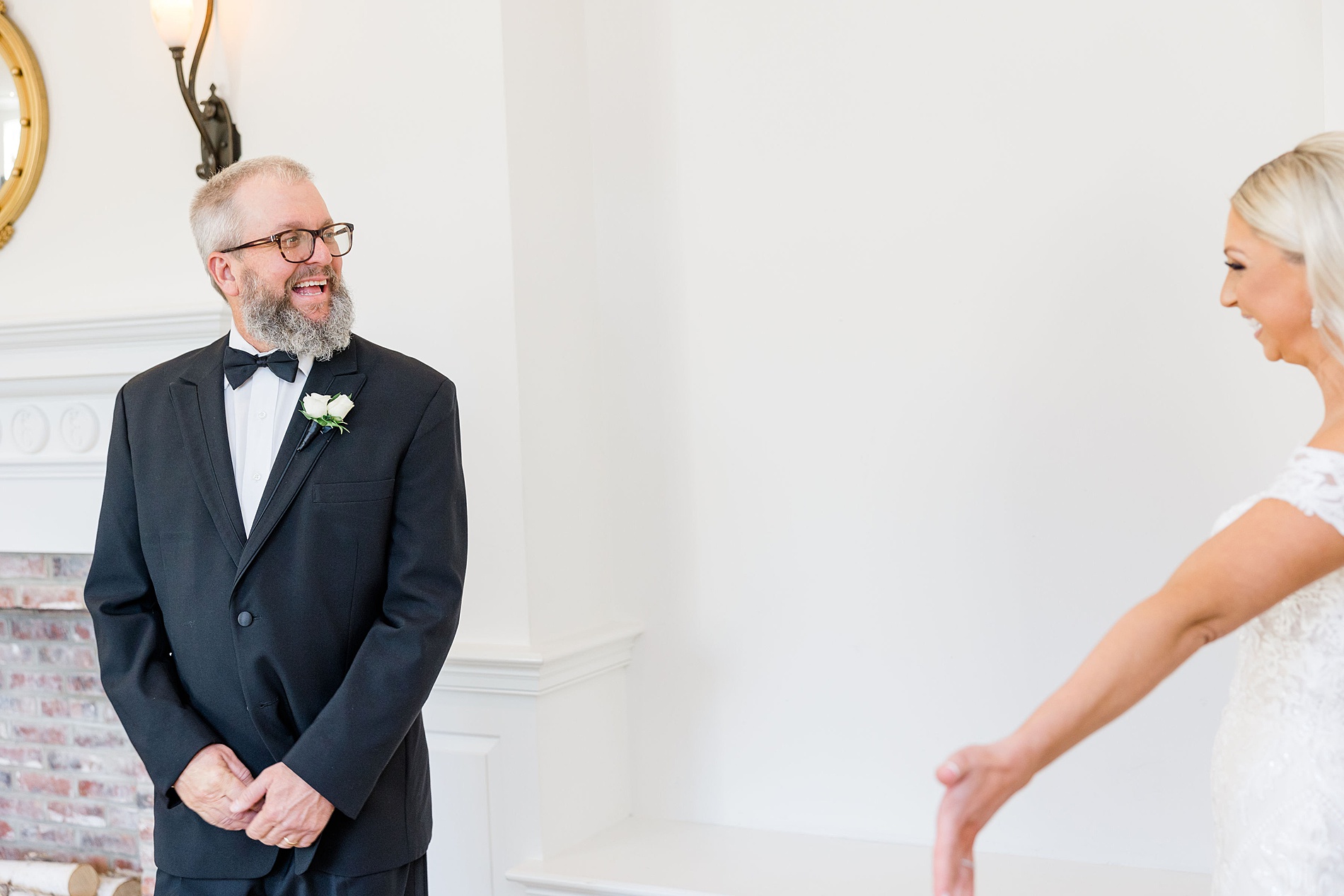 joyous reactions between bride and father during first look 