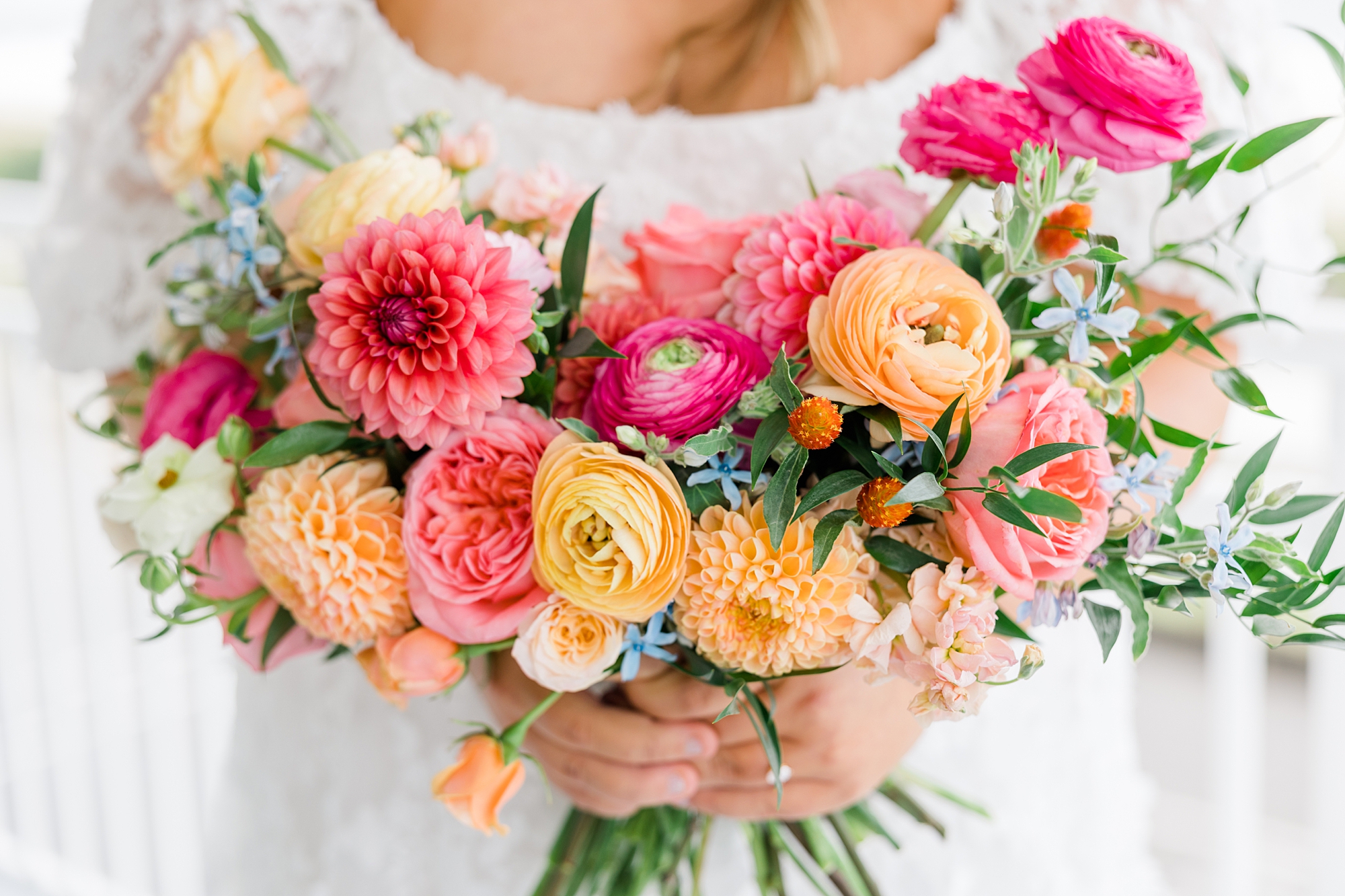 gorgeous and bright wedding bouquet with hot pink, blush, and pale orange flowers