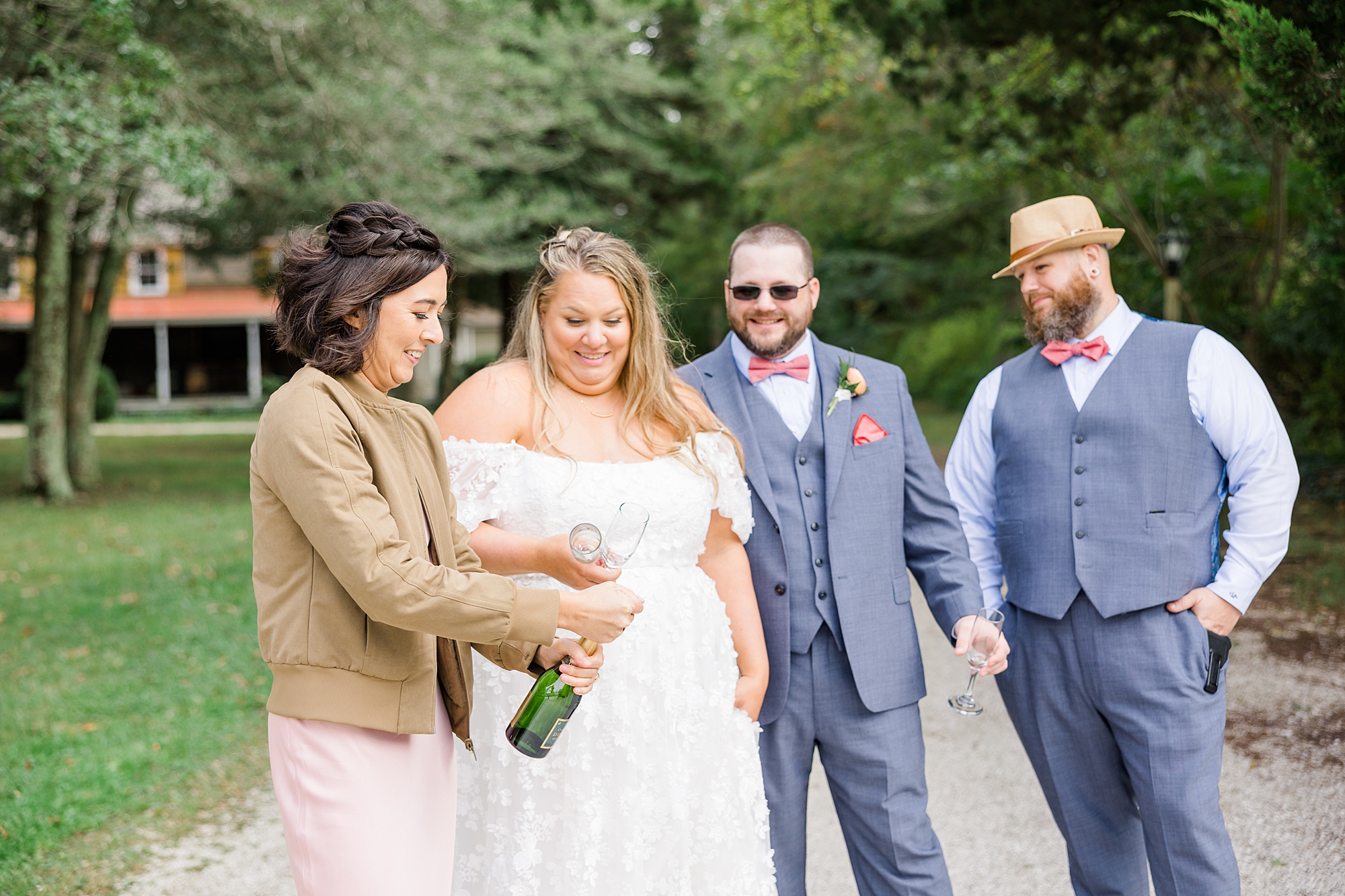 bridal party celebrates with champagne