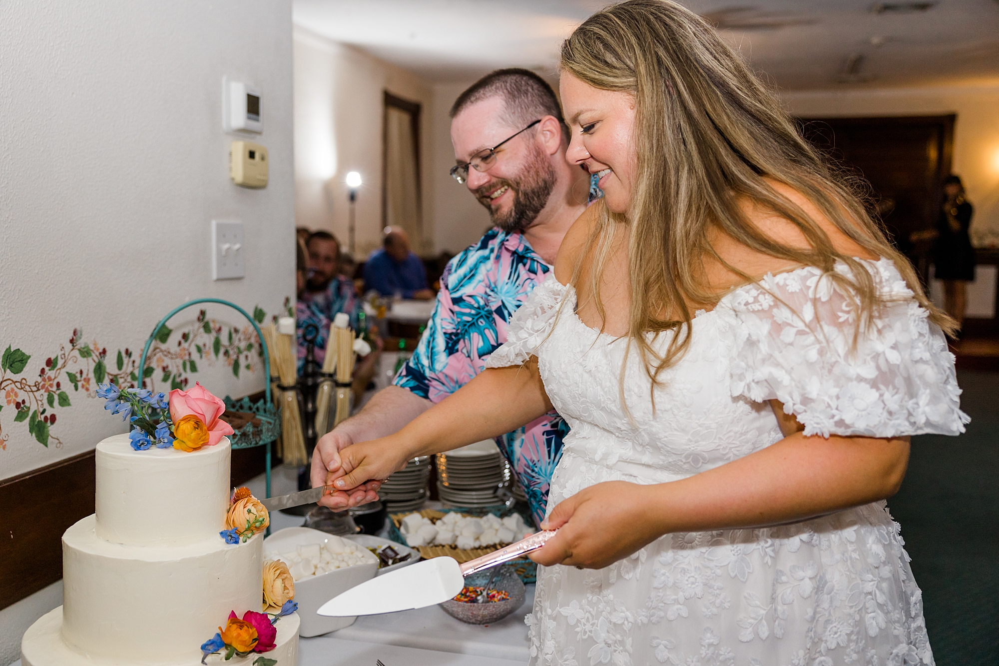 Couple cut their wedding cake