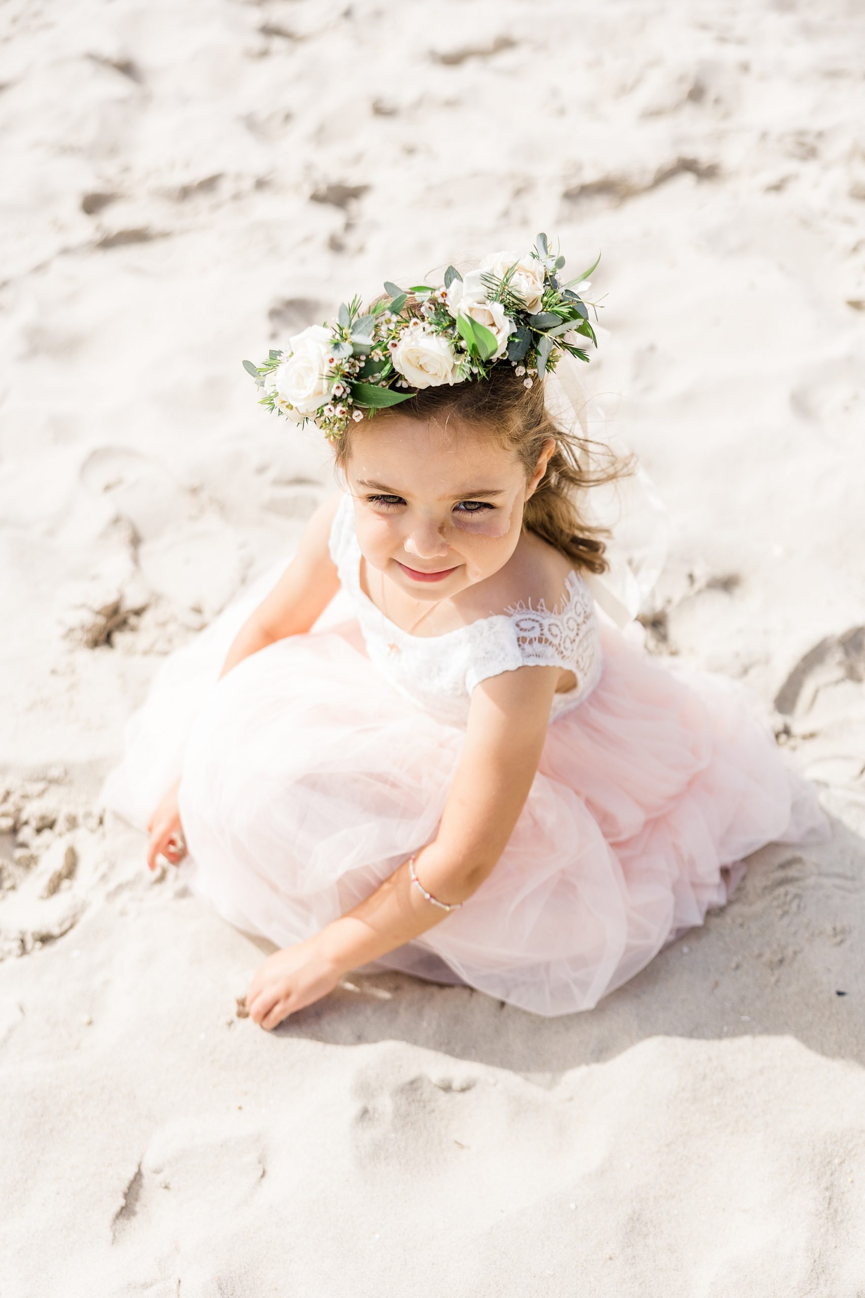 little girl plays in the sand