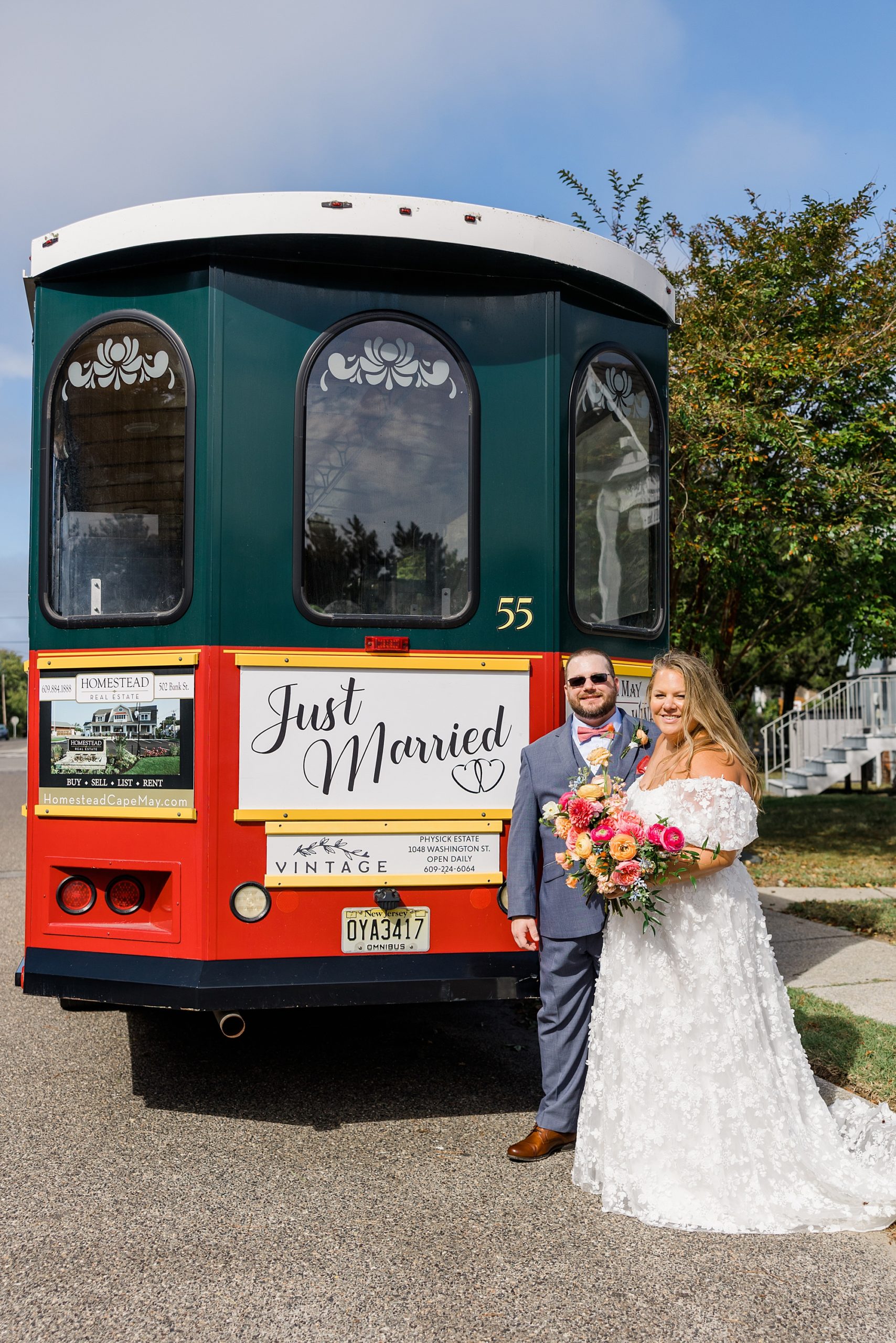couple by trolley with Just Married sign