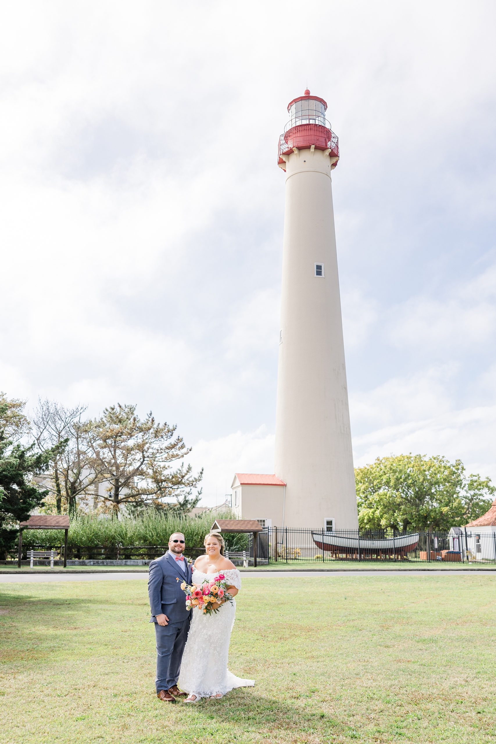 newlyweds by lighthouse in NJ