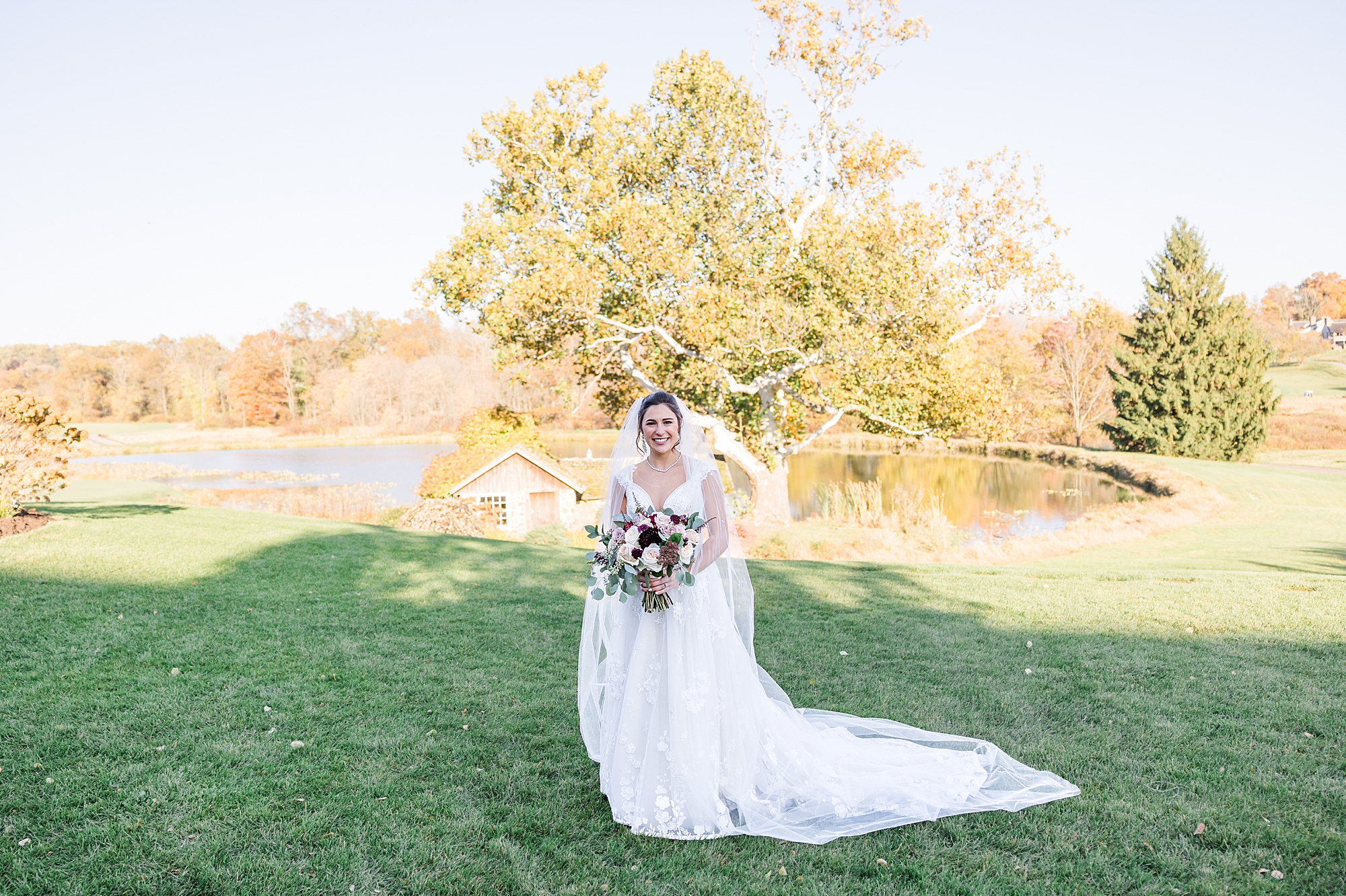 bride portraits by pond at French Creek