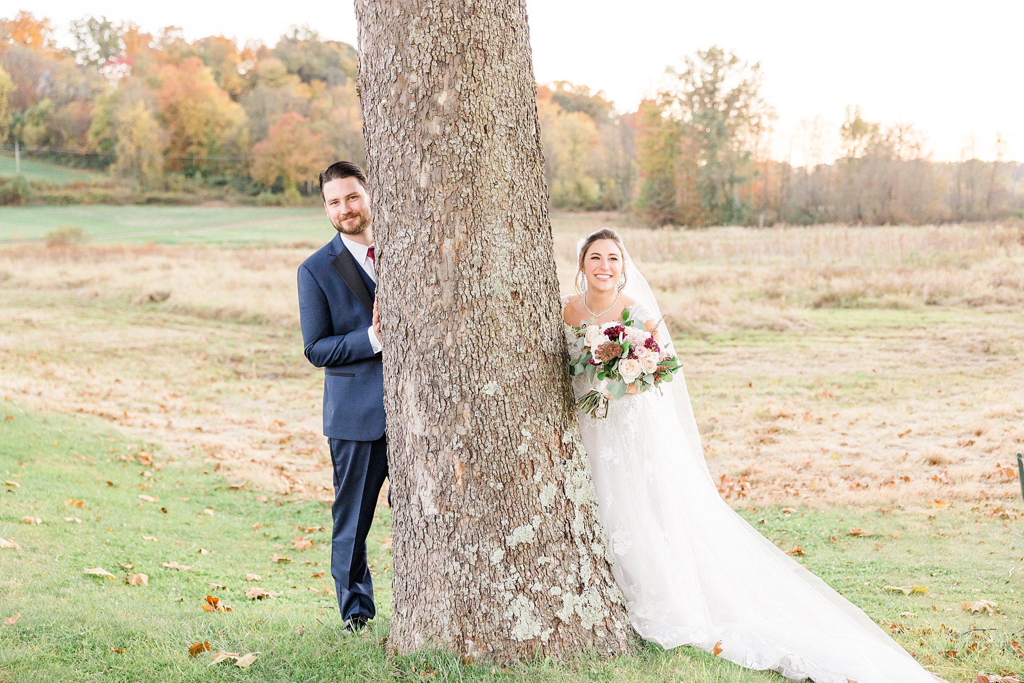 couple by tree during wedding portaits in Chester County PA at French Creek