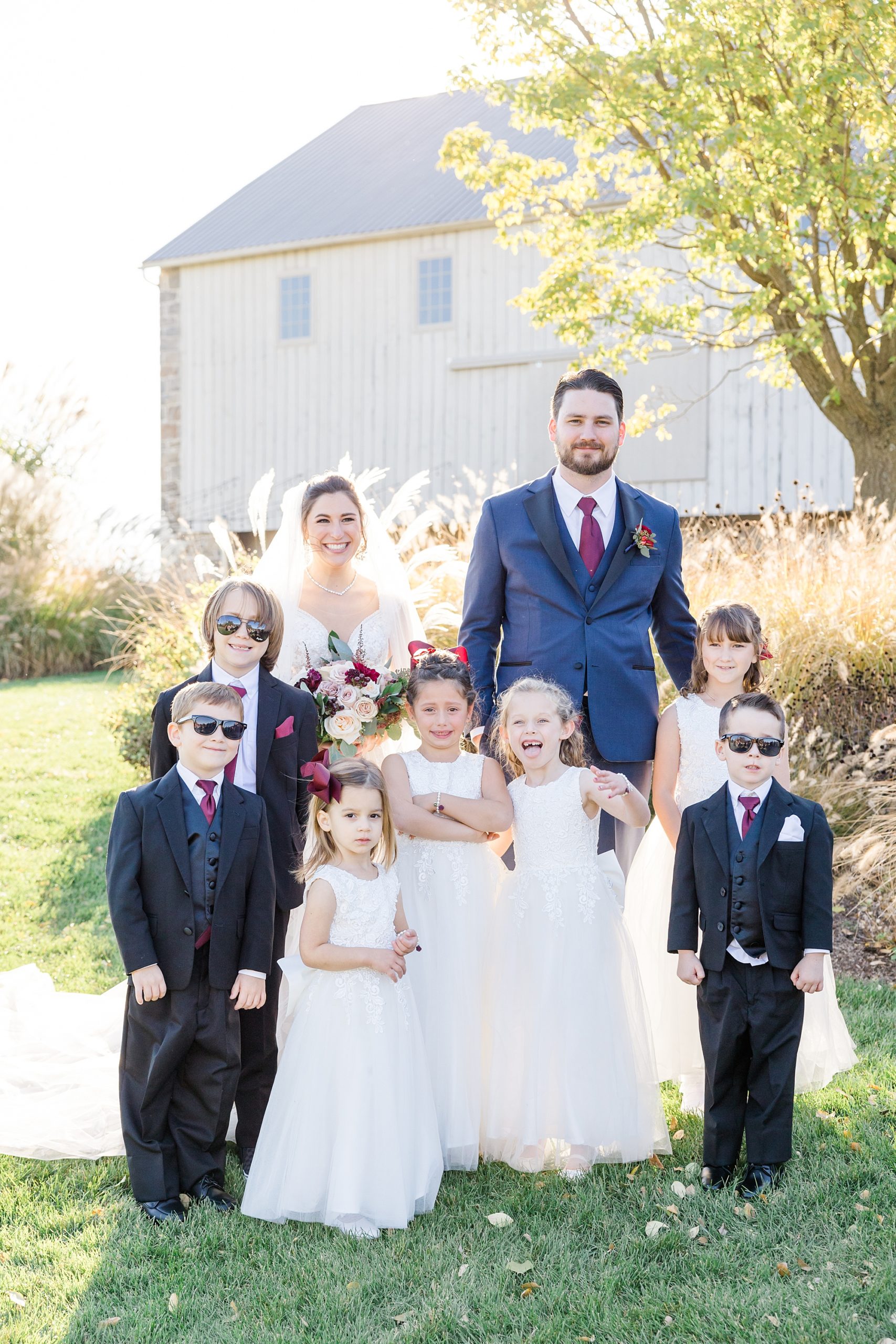 bride and groom with flower girls and ring bearers 