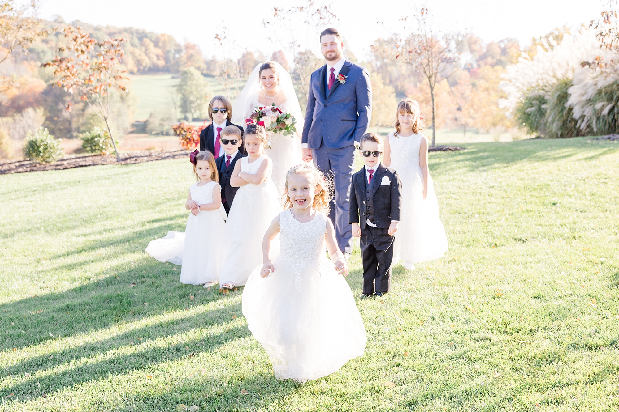 couple with their flower girls and ring bearers from Fall Wedding at French Creek Golf Club