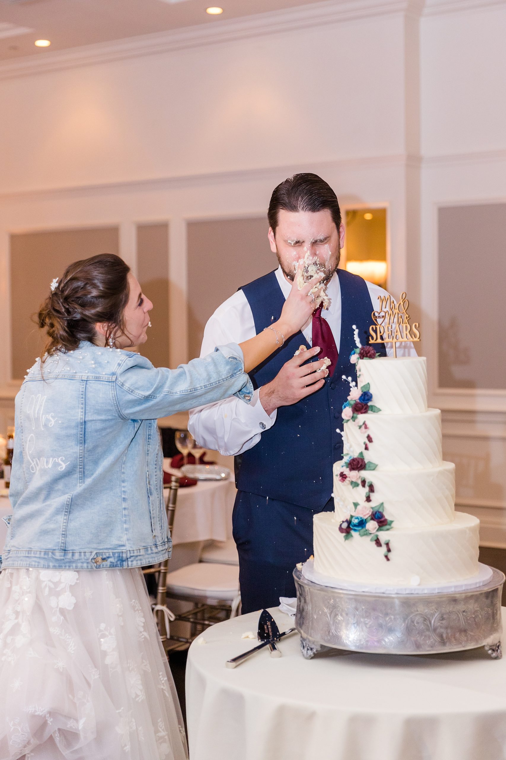 bride smashes cake in groom's face