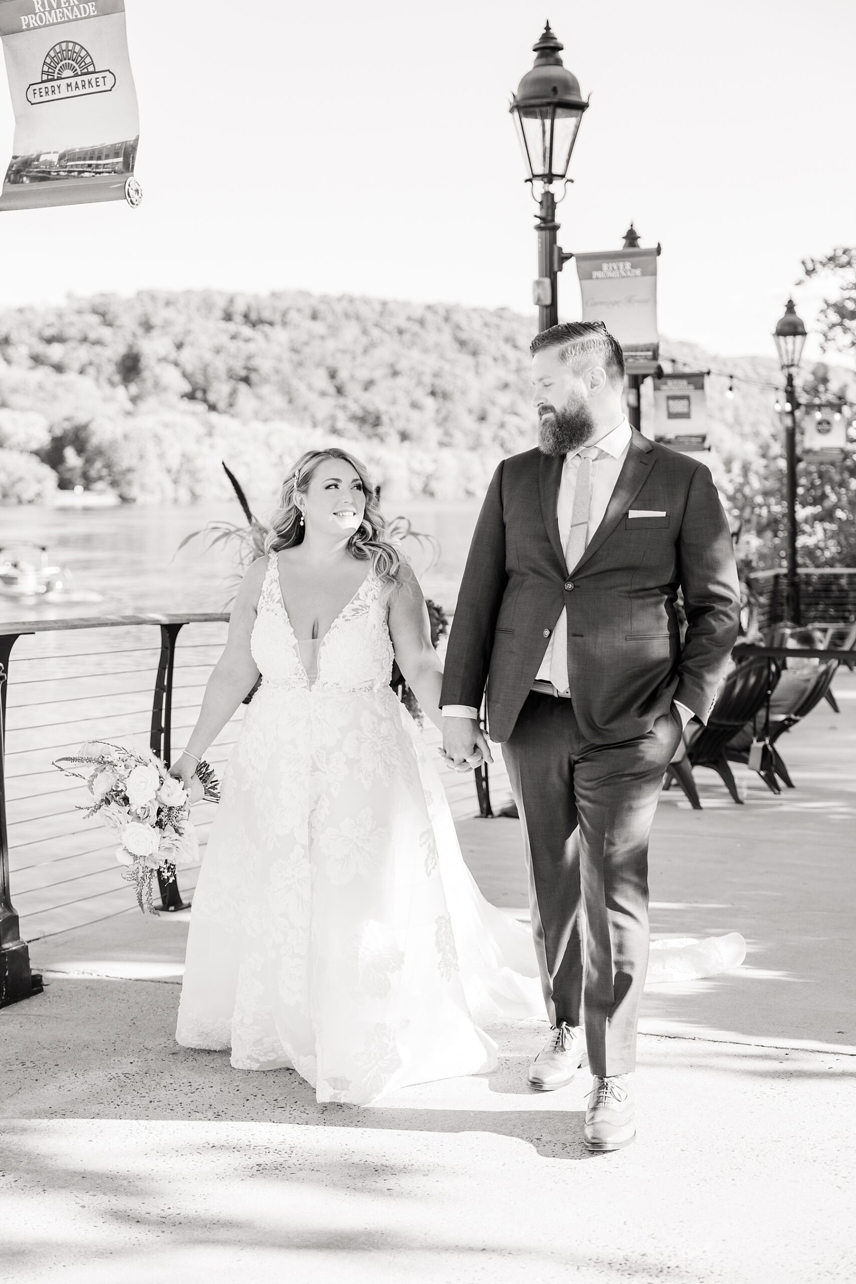 couple walk by the water at PA wedding venue