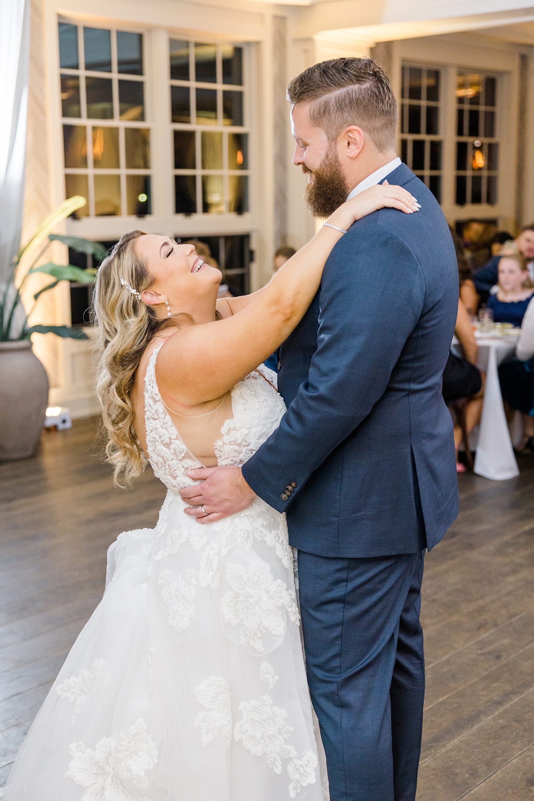 candid wedding portrait of couple dancing together 