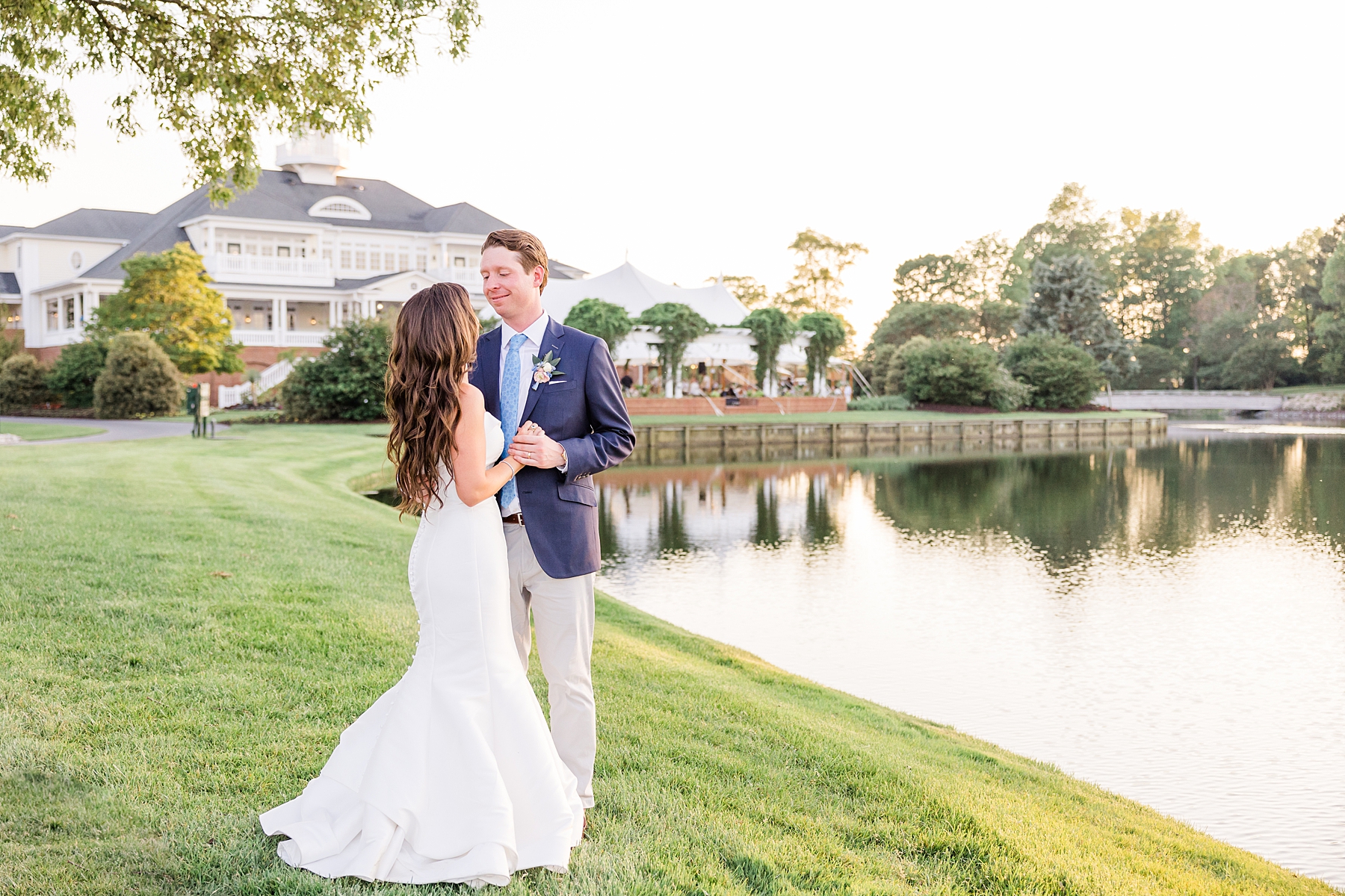couple dance by pond at Delaware wedding venue Baywood Greens