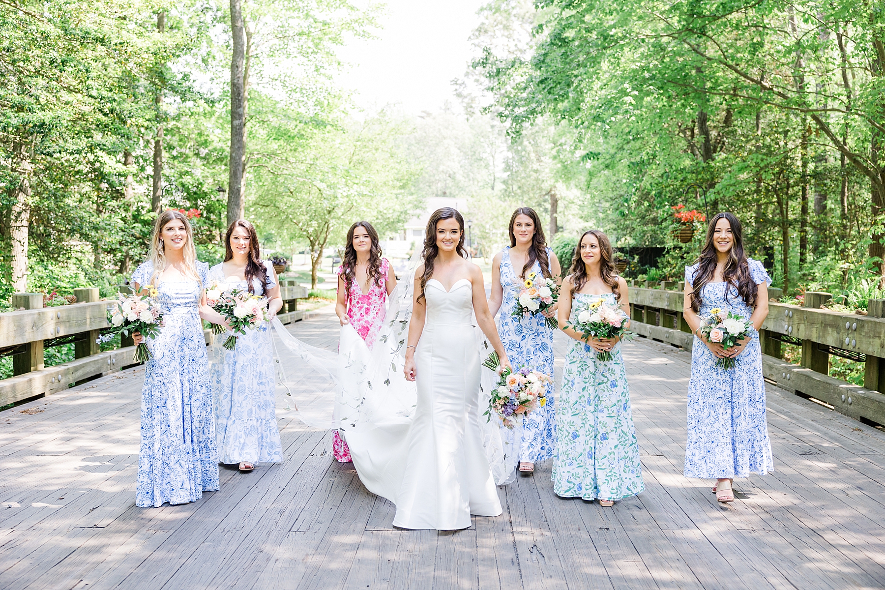bridesmaids walk behind bride