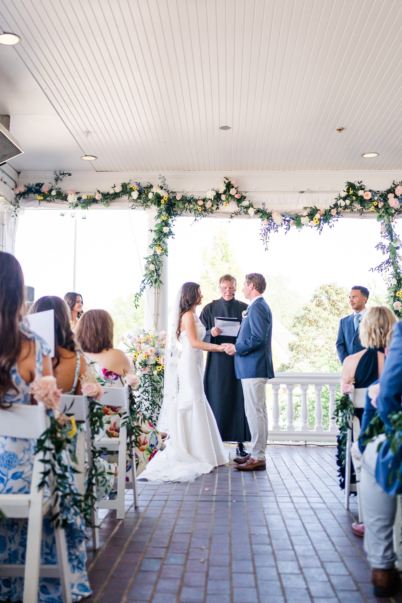 wedding ceremony on porch at Baywood Greens