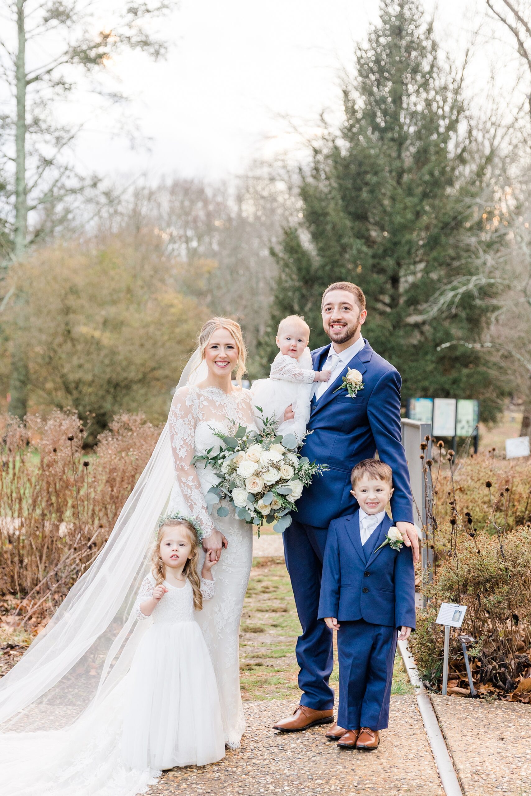 bride and groom with their three children after Concordville Inn Winter Wedding