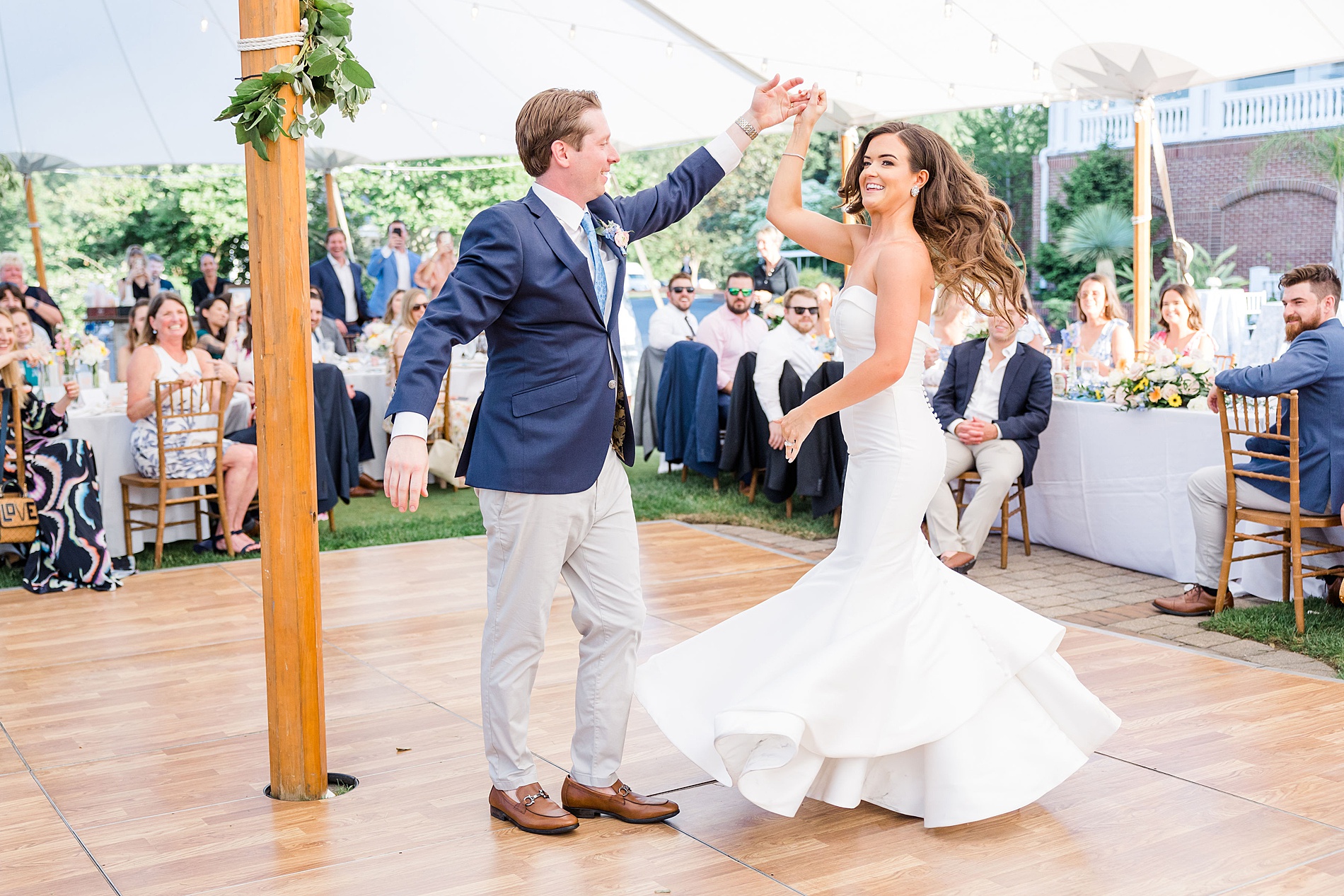 newlyweds dance at chic garden wedding reception