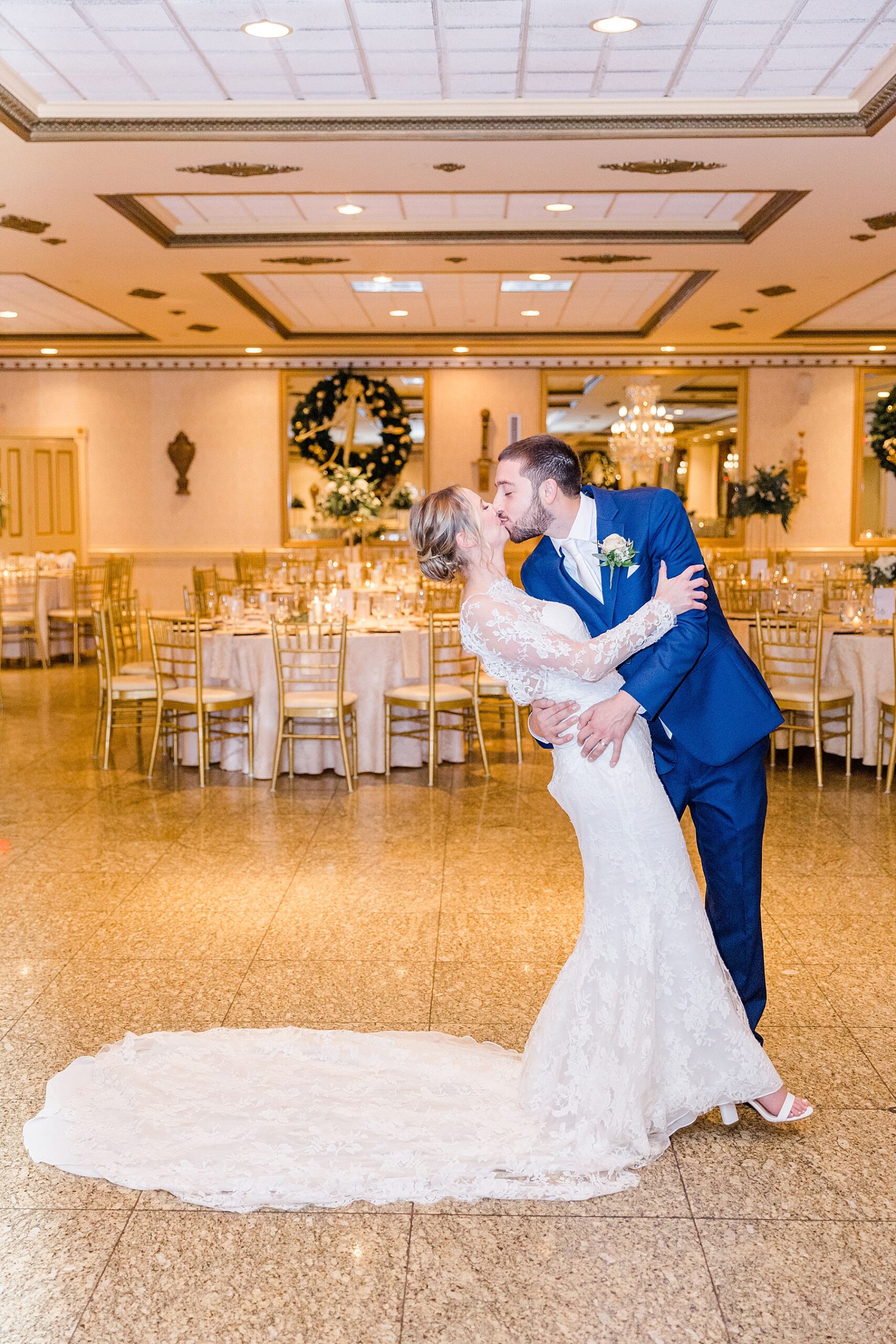 bride and groom kiss on dance floor