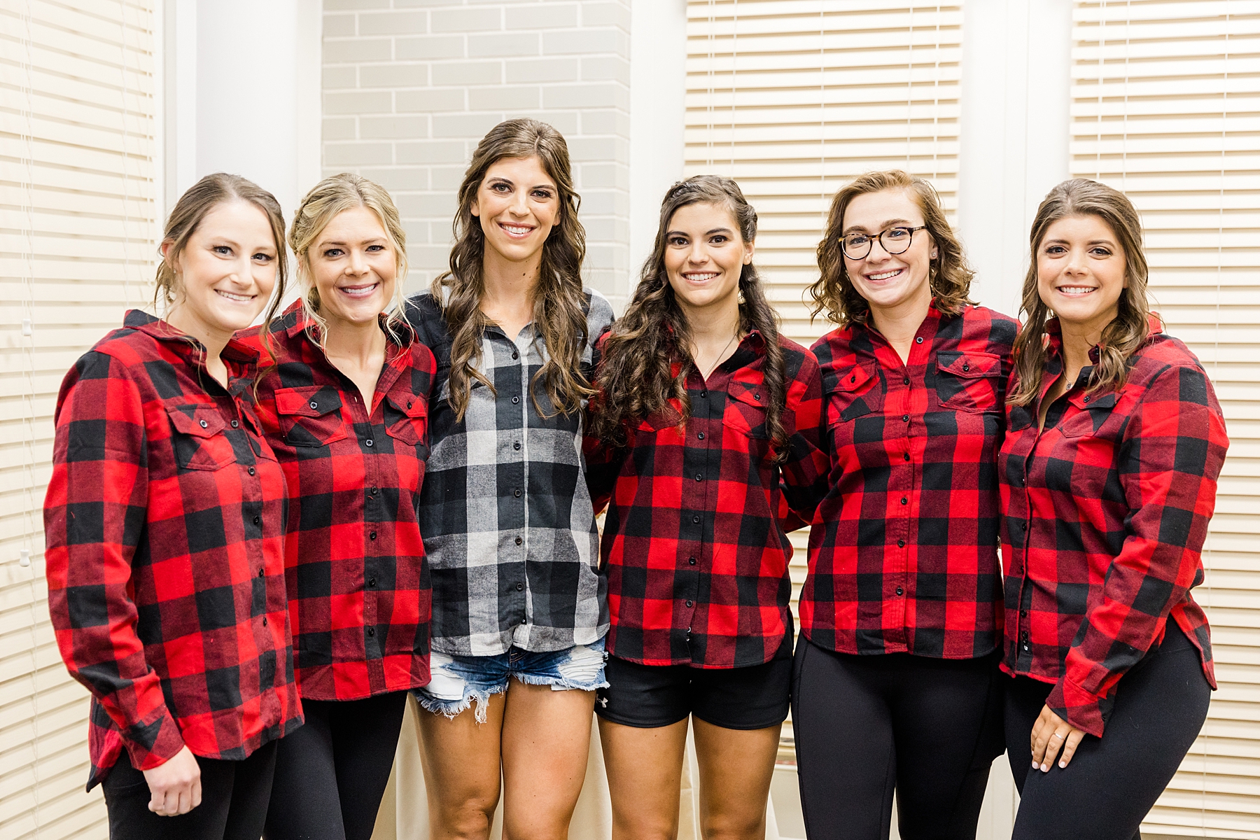 bride and bridesmaids in matching flannels 
