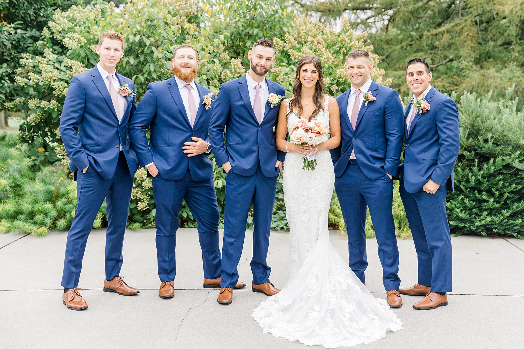 bride with groom and groomsmen