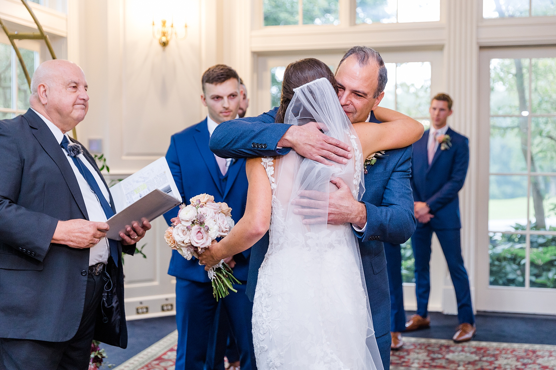 dad hugs daughter at Deerfield Country Club Wedding ceremony