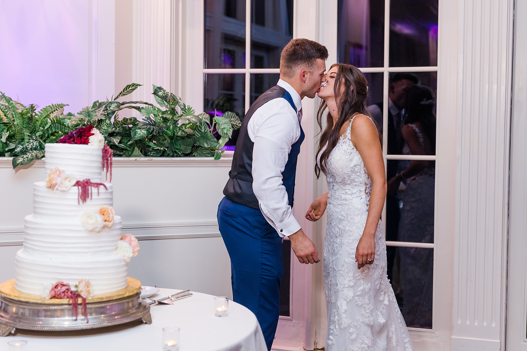 couple kiss at Deerfield Country Club Wedding reception