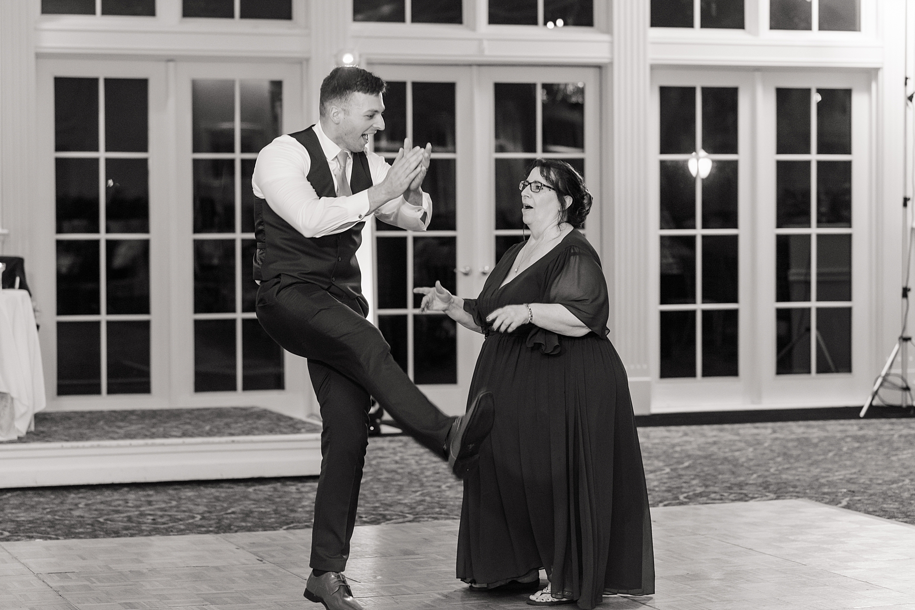 groom and mother dance together 