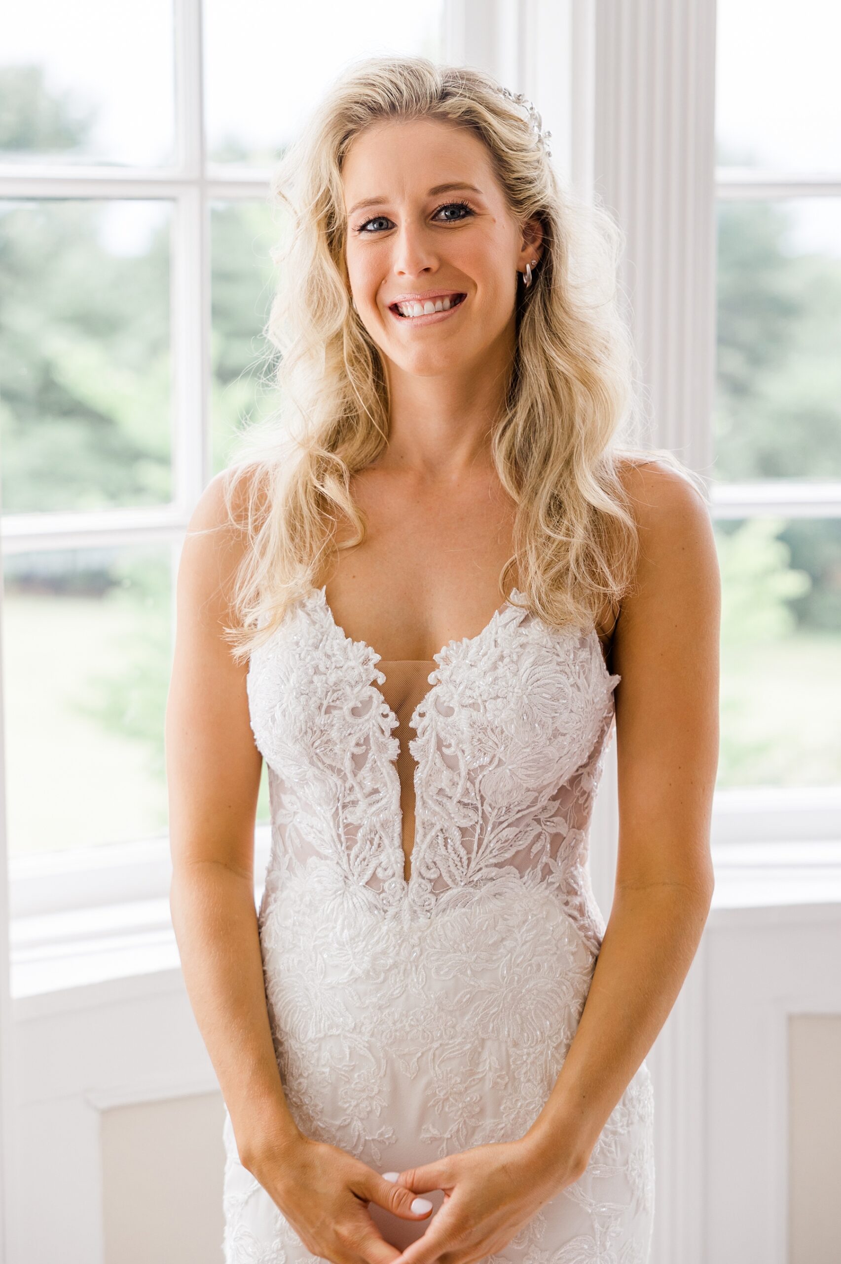 front of bride's wedding dress with intricate lace detail