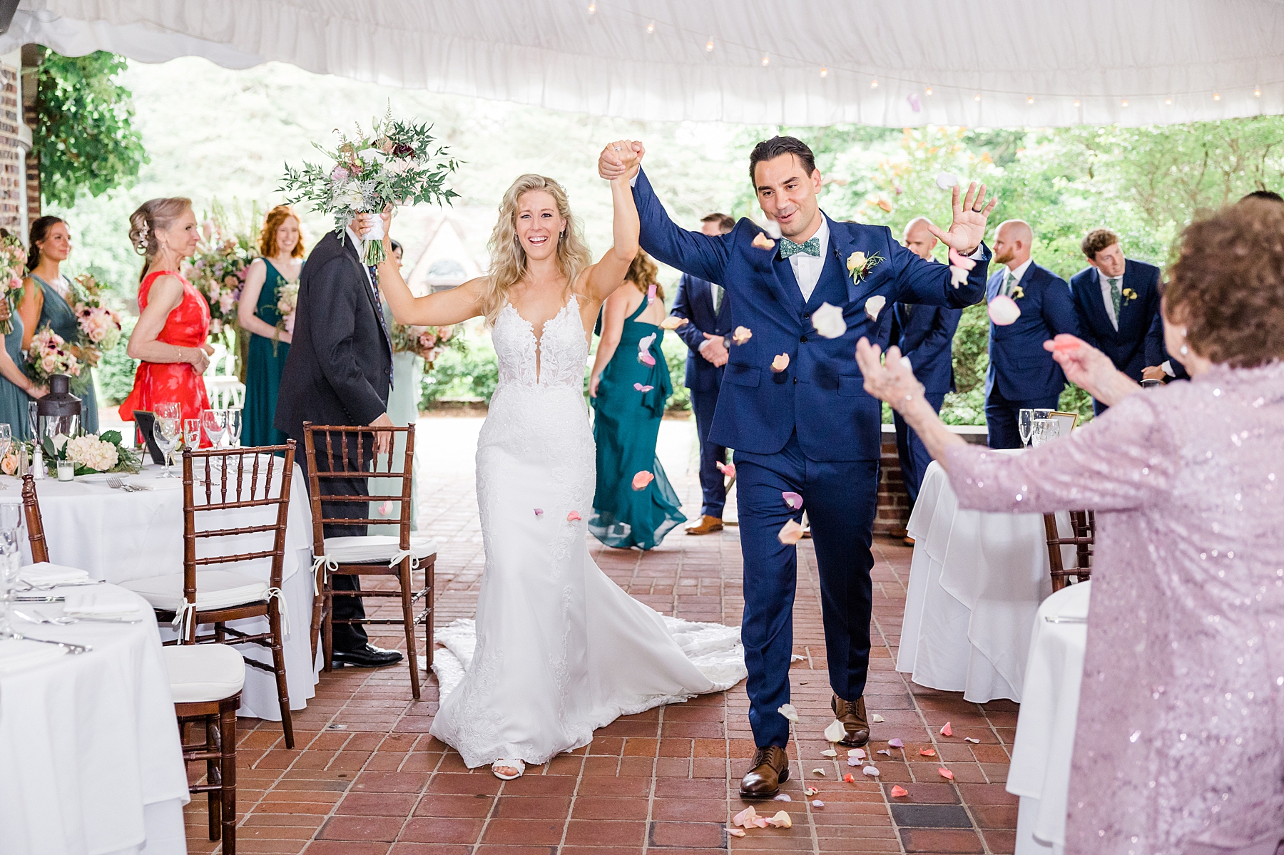 newlyweds exit ceremony as guests toss flower petals