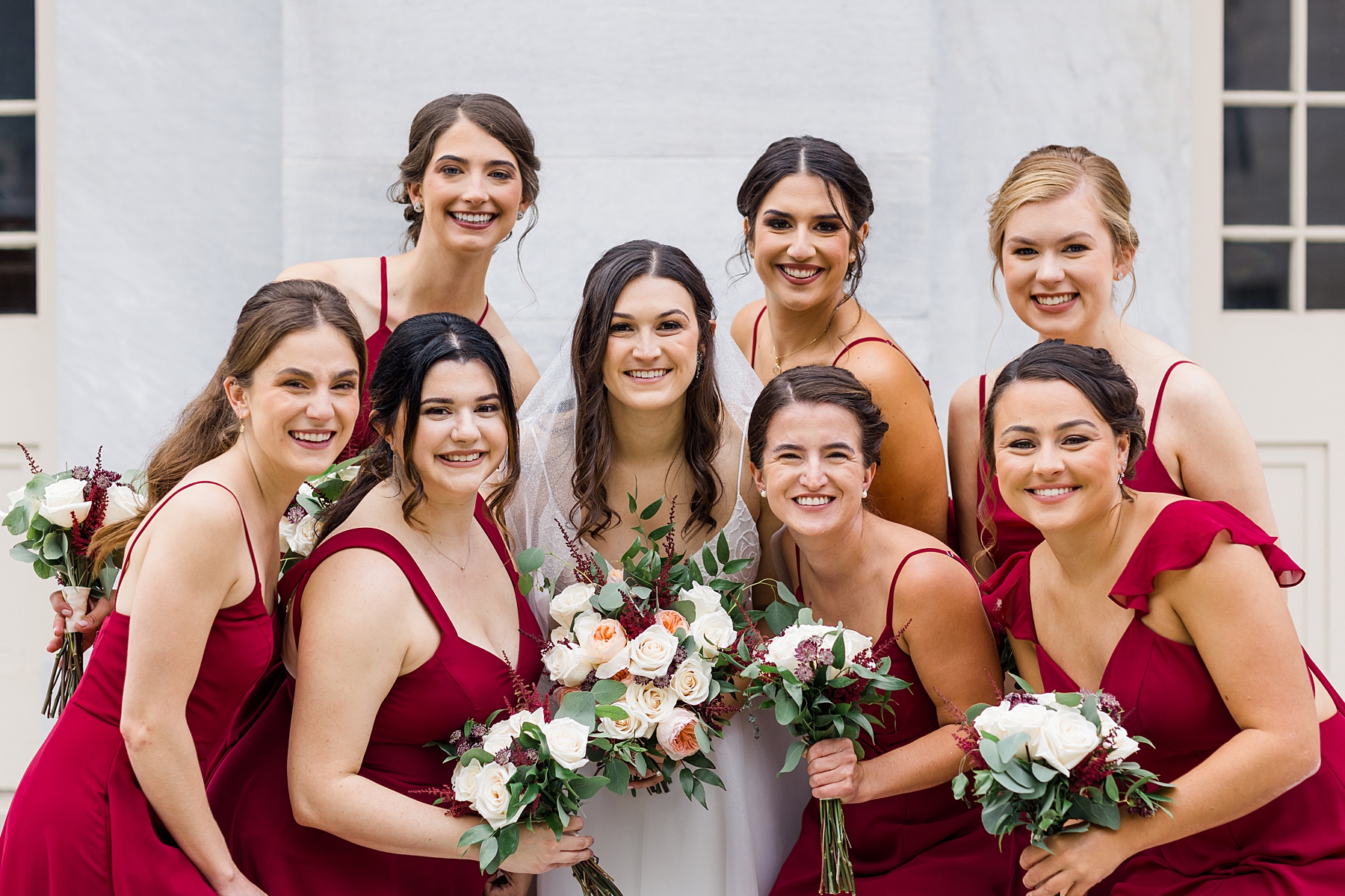 bride and bridesmaids hold romantic wedding bouquets