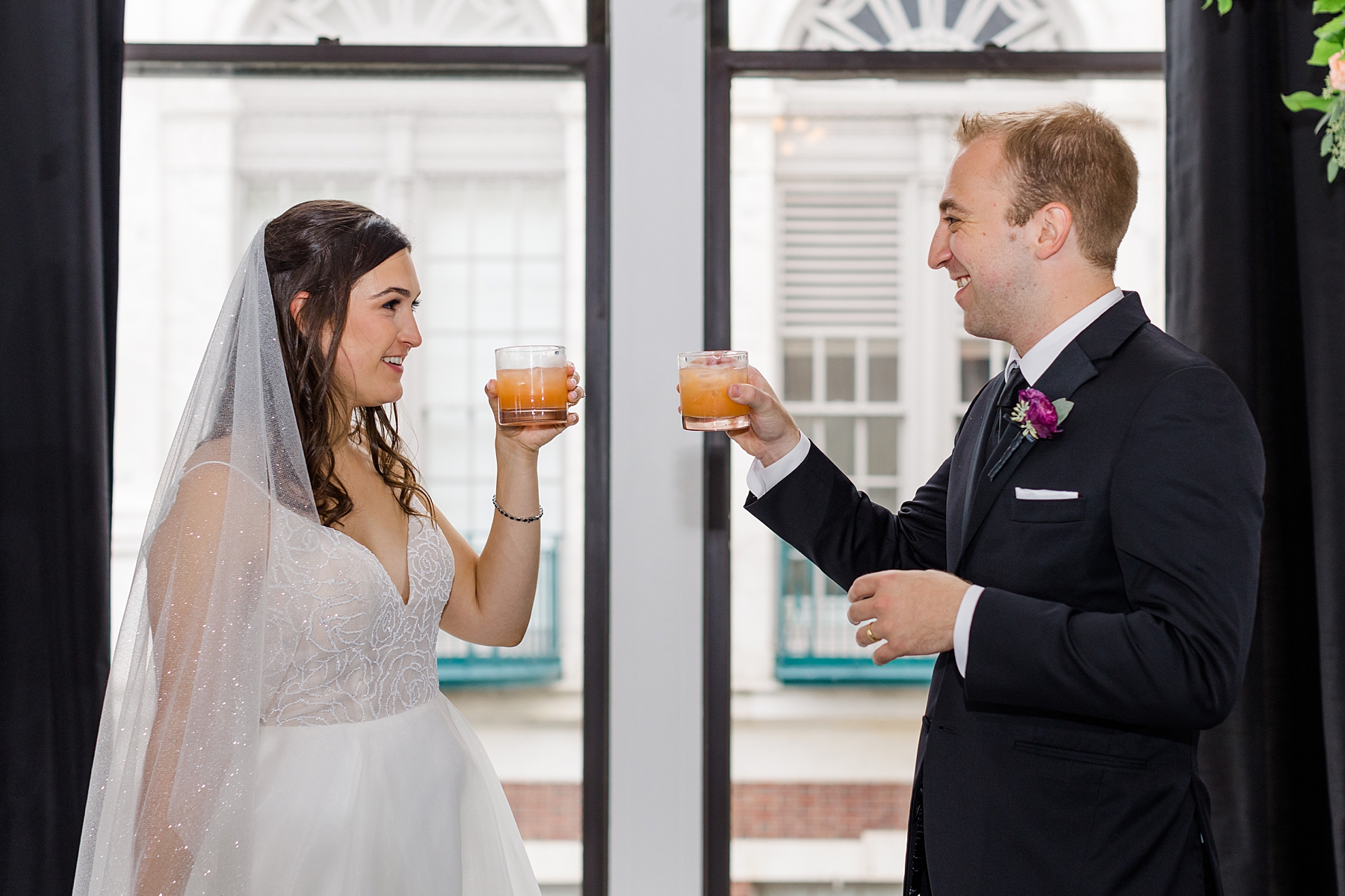 newlyweds toast before reception