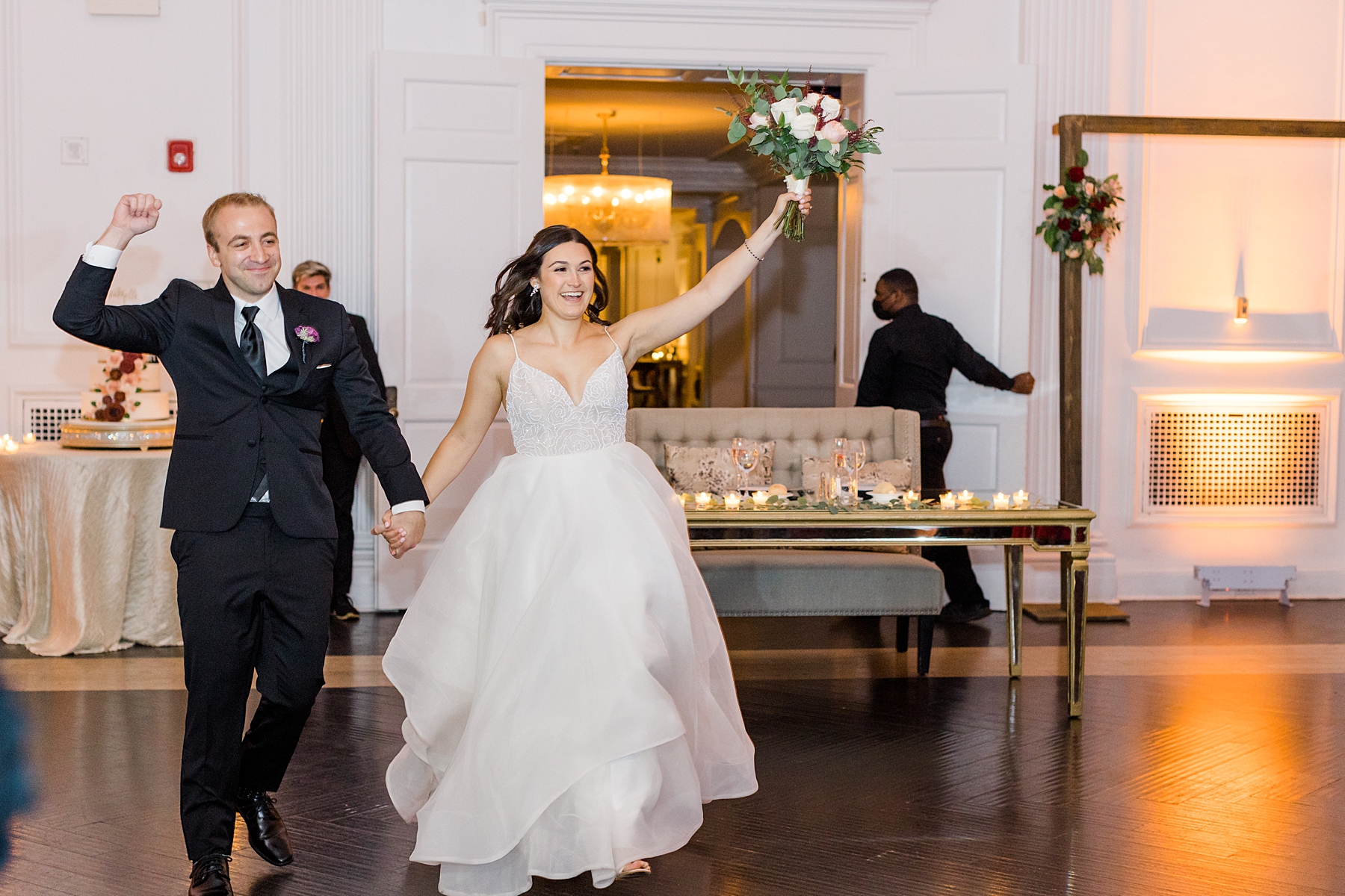 bride and groom make entrance into reception at The Down Town Club in Philadelphia, PA
