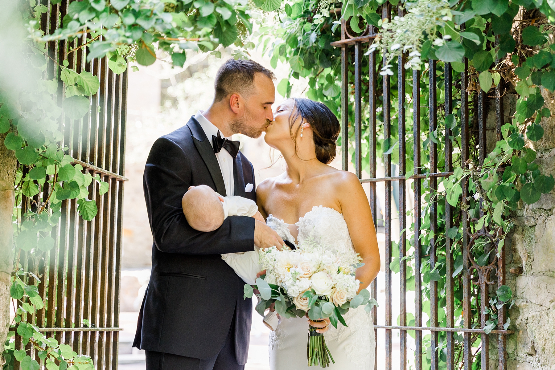 bride and groom kiss in garden 